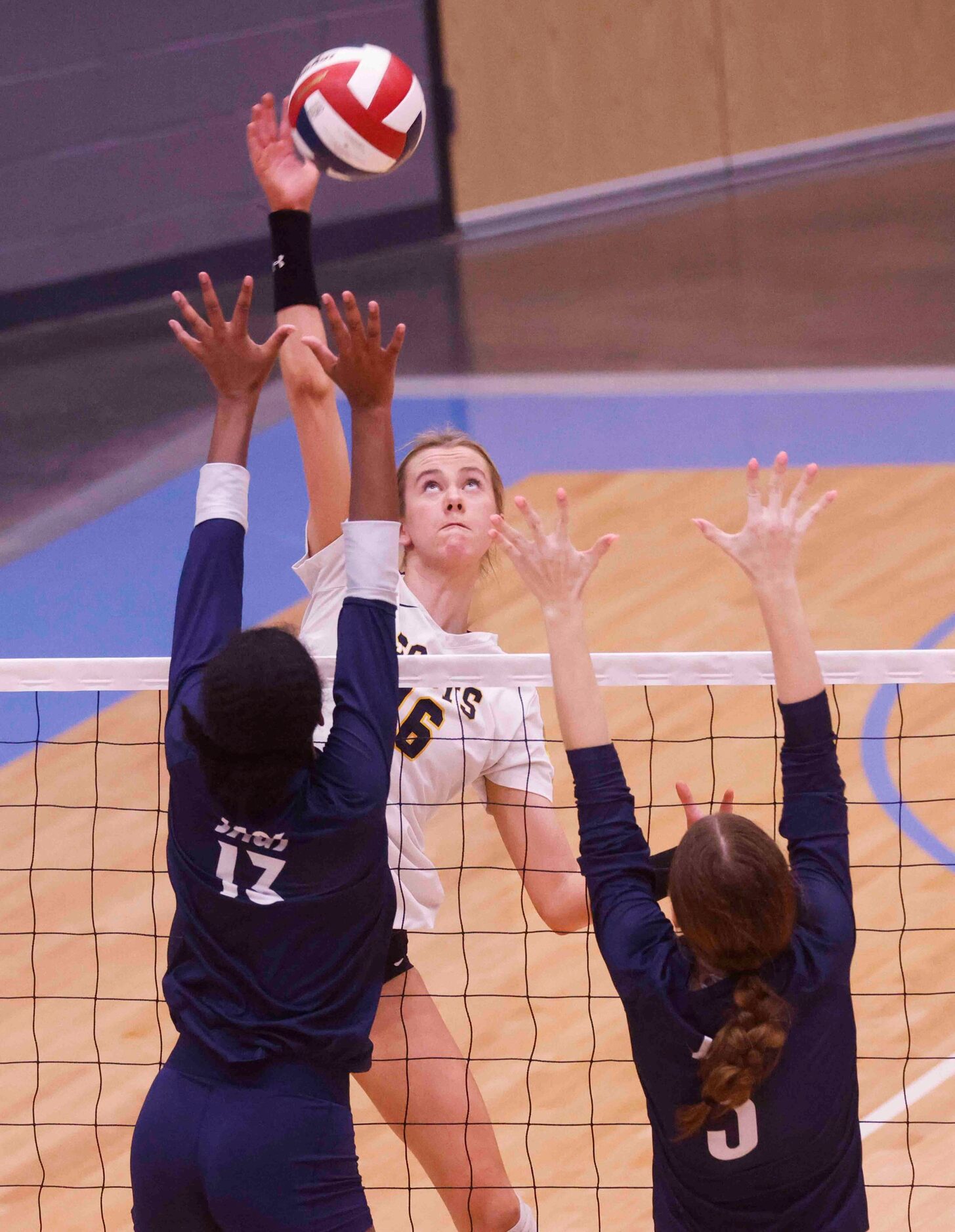 Highland Park’s Nicole Mauser (16) spikes the ball against Flower Mound’s Brianna Watson...