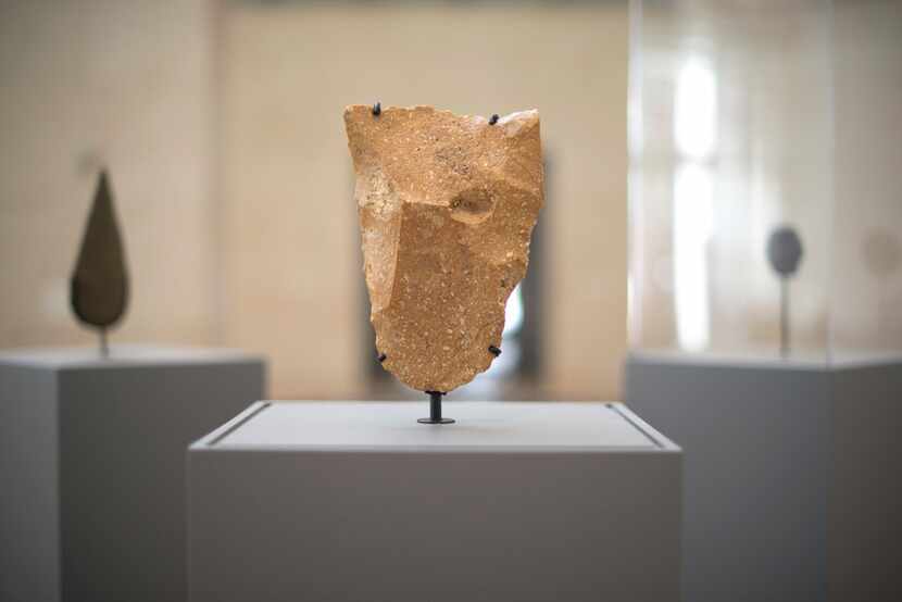 A quartzite cleaver, found in Mauritania and exhibited at 'First Sculpture' at the...