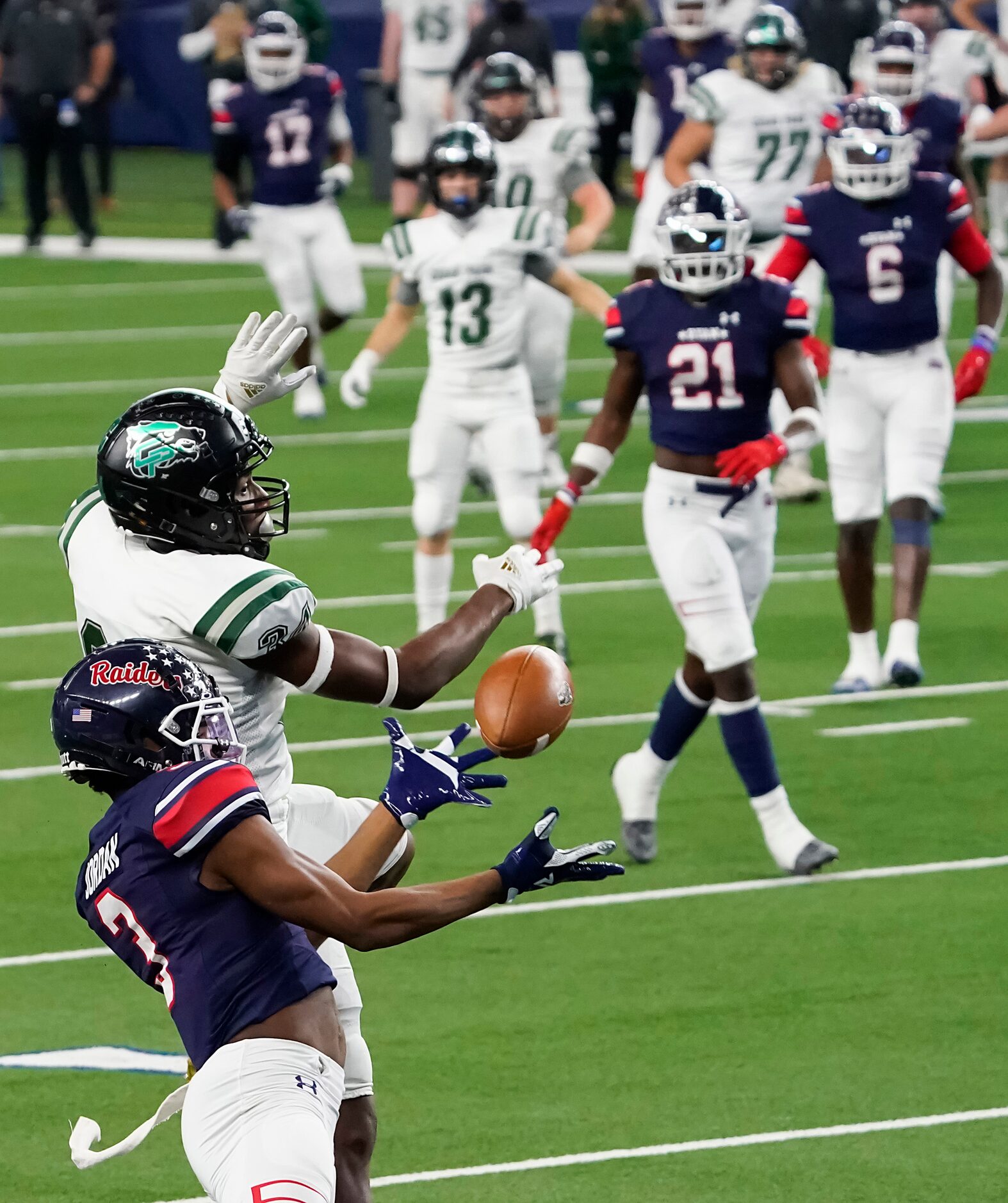 Denton Ryan Austin Jordan (3) nearly intercepts a pass intended for Cedar Park wide receiver...