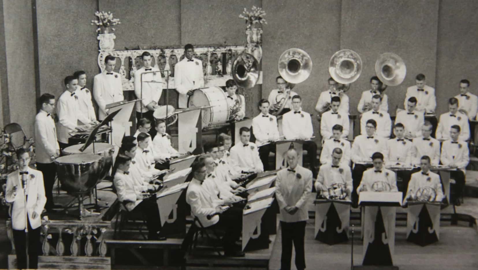 In a copy of a Jesuit school photo, Charles Edmond can be seen at the bass drum in the band....