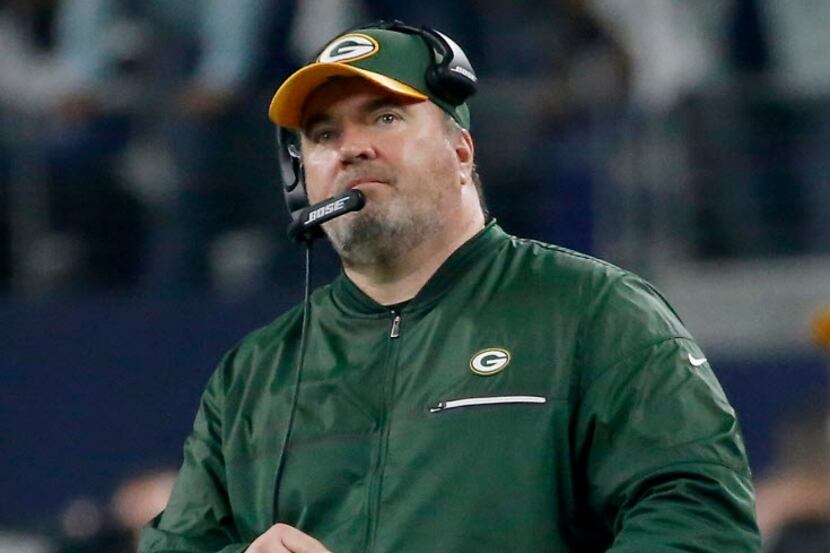 Green Bay Packers head coach Mike McCarthy watches a scoreboard during the fourth quarter...