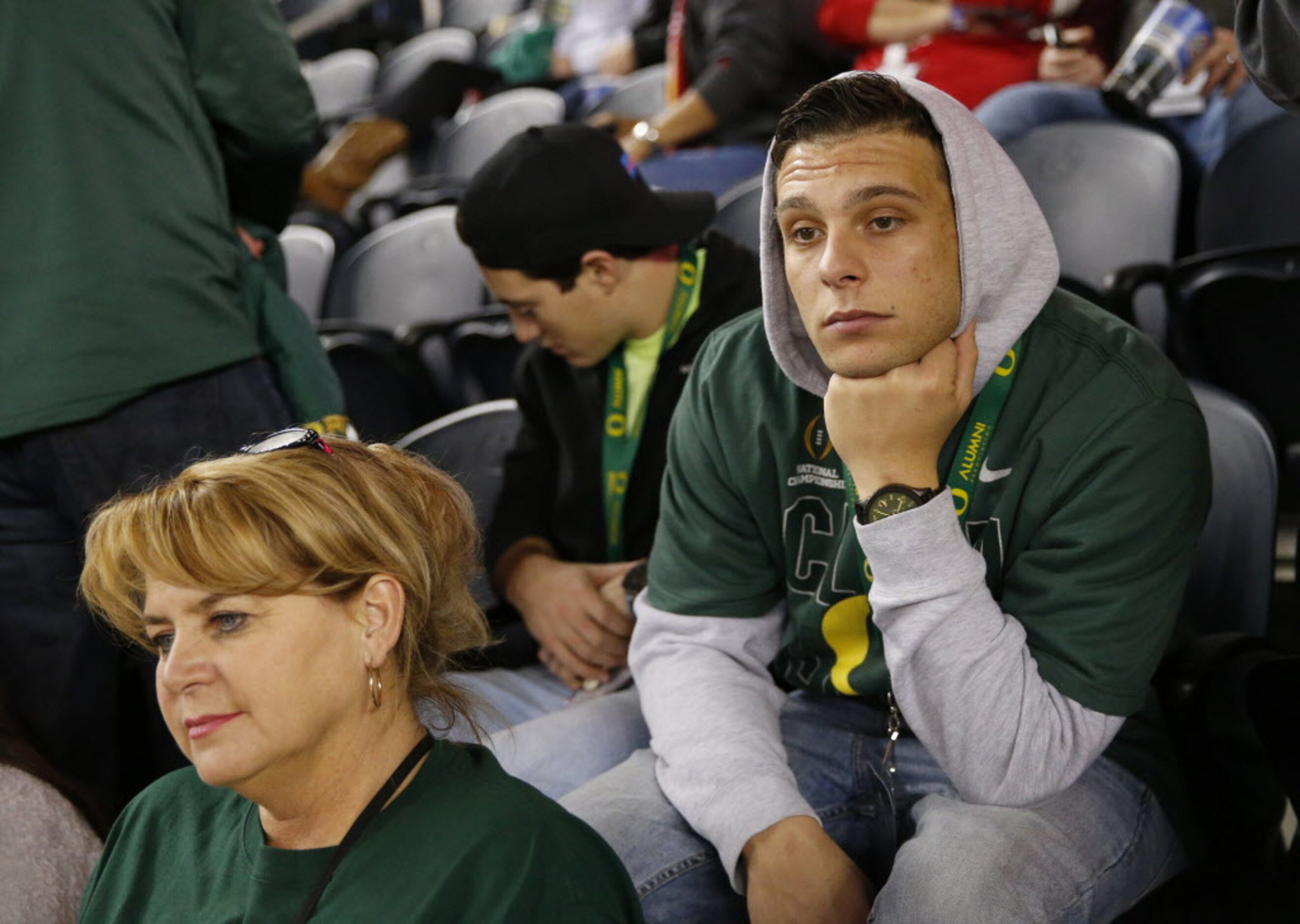 Oregon Ducks fan Nathaniel Dillon, of Murrieta, California, looks dejected after the Ducks...