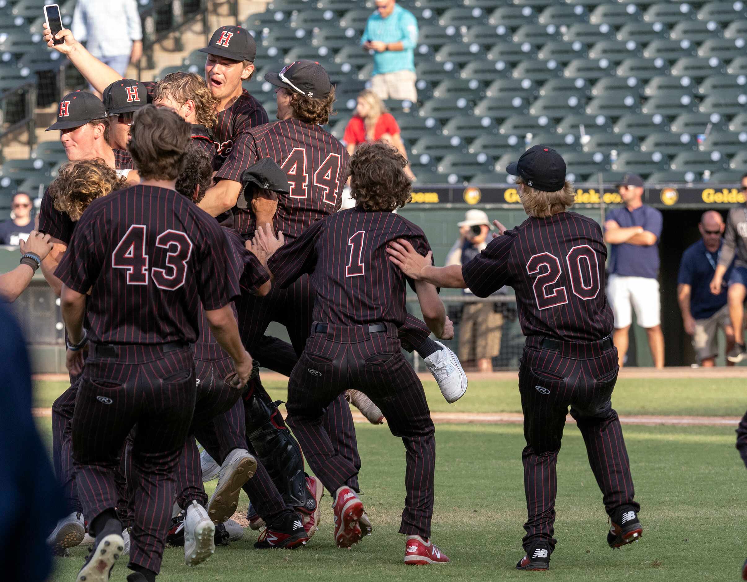 Members of the Rockwall-Heath Hawks celebrate their state victory over Keller during the...