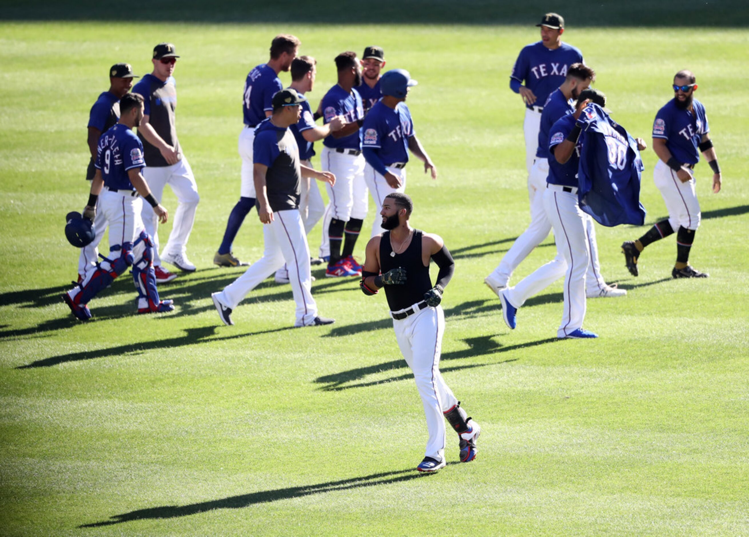 ARLINGTON, TEXAS - MAY 19:  The Texas Rangers celebrate the game winning run scored on a...