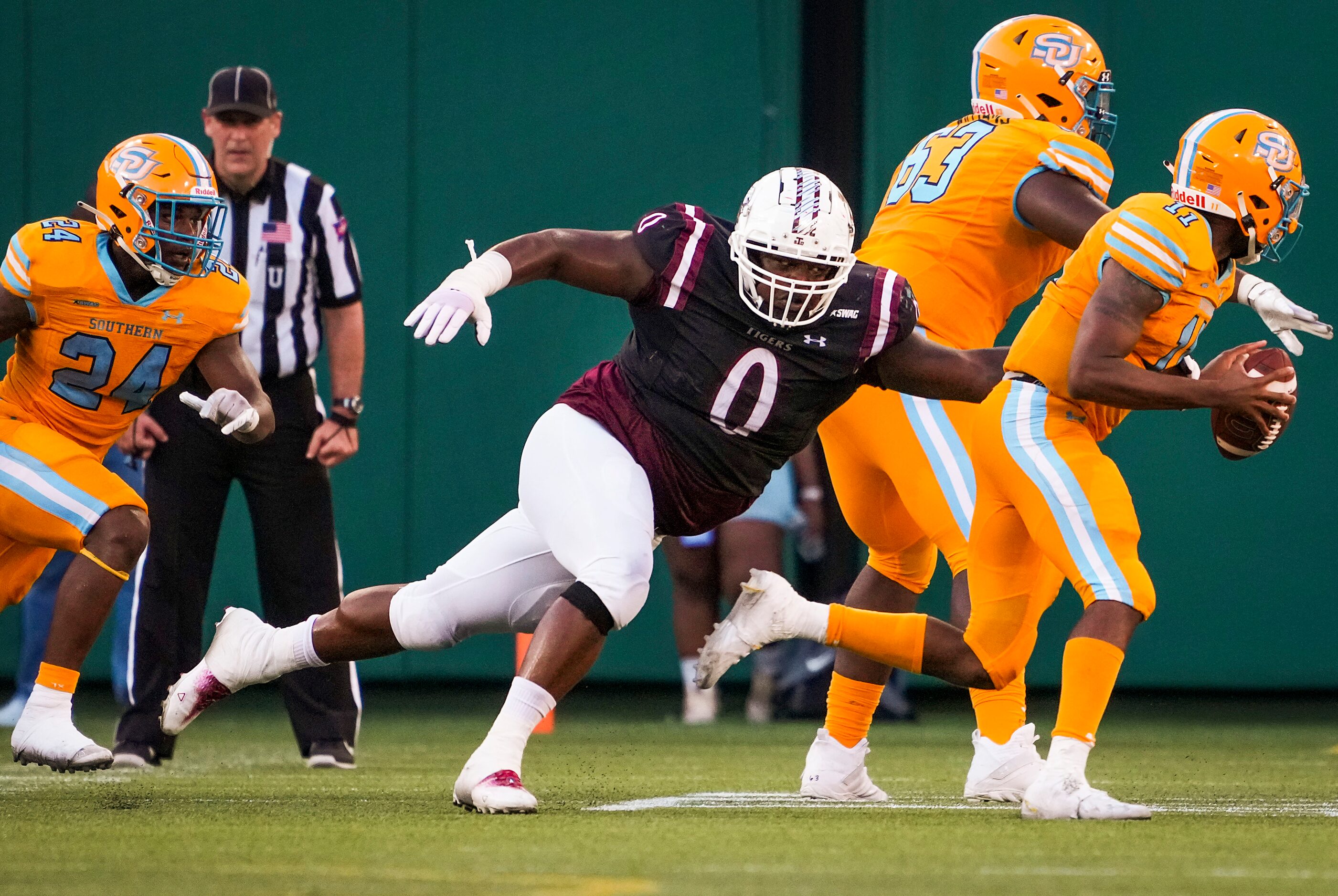 TSU defensive tackle Viramontes Pippens (0) runs down Southern quarterback  BeSean McCray...