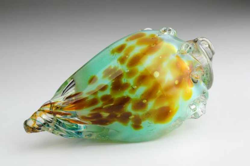 
Mouth-blown and hand-shaped glass  conch shells by Raymond Rains, a Fort Worth glass...