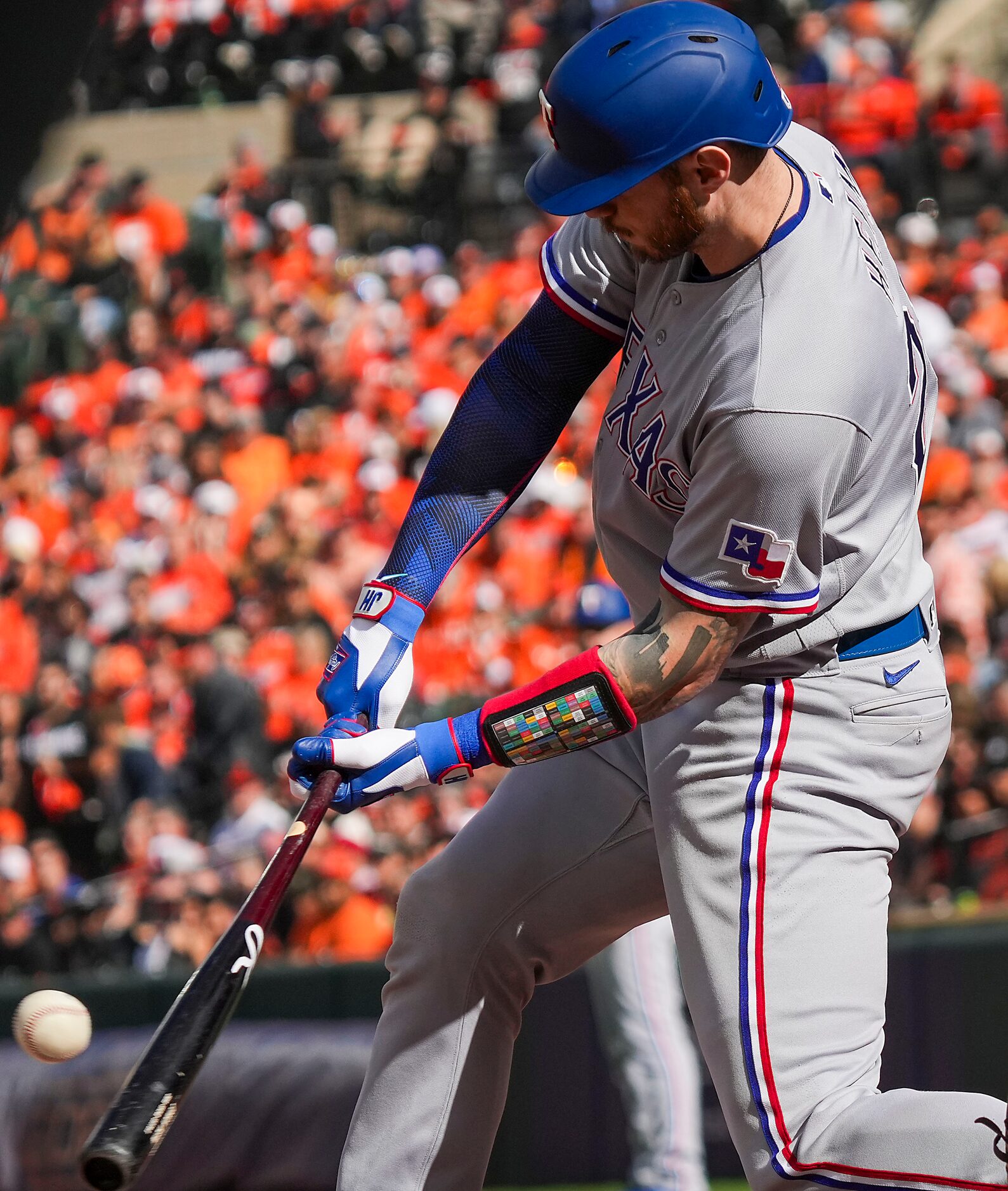 Texas Rangers catcher Jonah Heim drives in a run with a single during the fourth inning in...