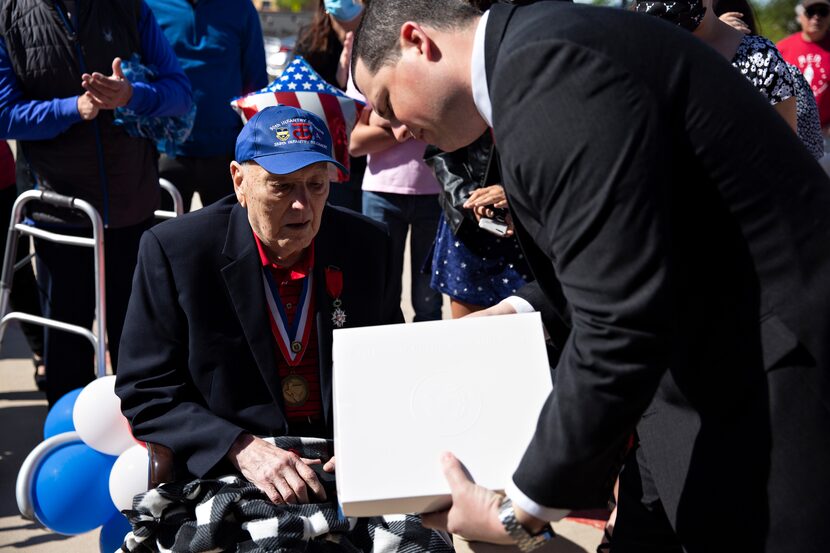 State Rep. Jared Patterson, R-Frisco, greets Burnie Sutter during the celebration. Sutter's...