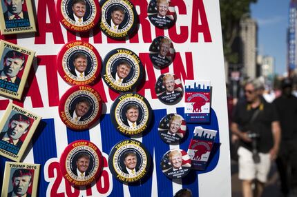 Vendors sell campaign buttons along Euclid Street on the third day of the Republican...