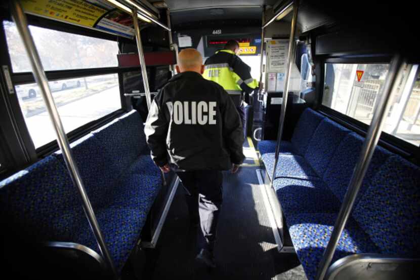DART police Sgt. John Kusewitt, followed by Officer P.C Wong, disembarks from a bus at...