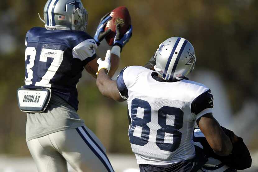 Dallas Cowboys strong safety Matt Johnson (37) intercepts a pass intended for Dallas Cowboys...