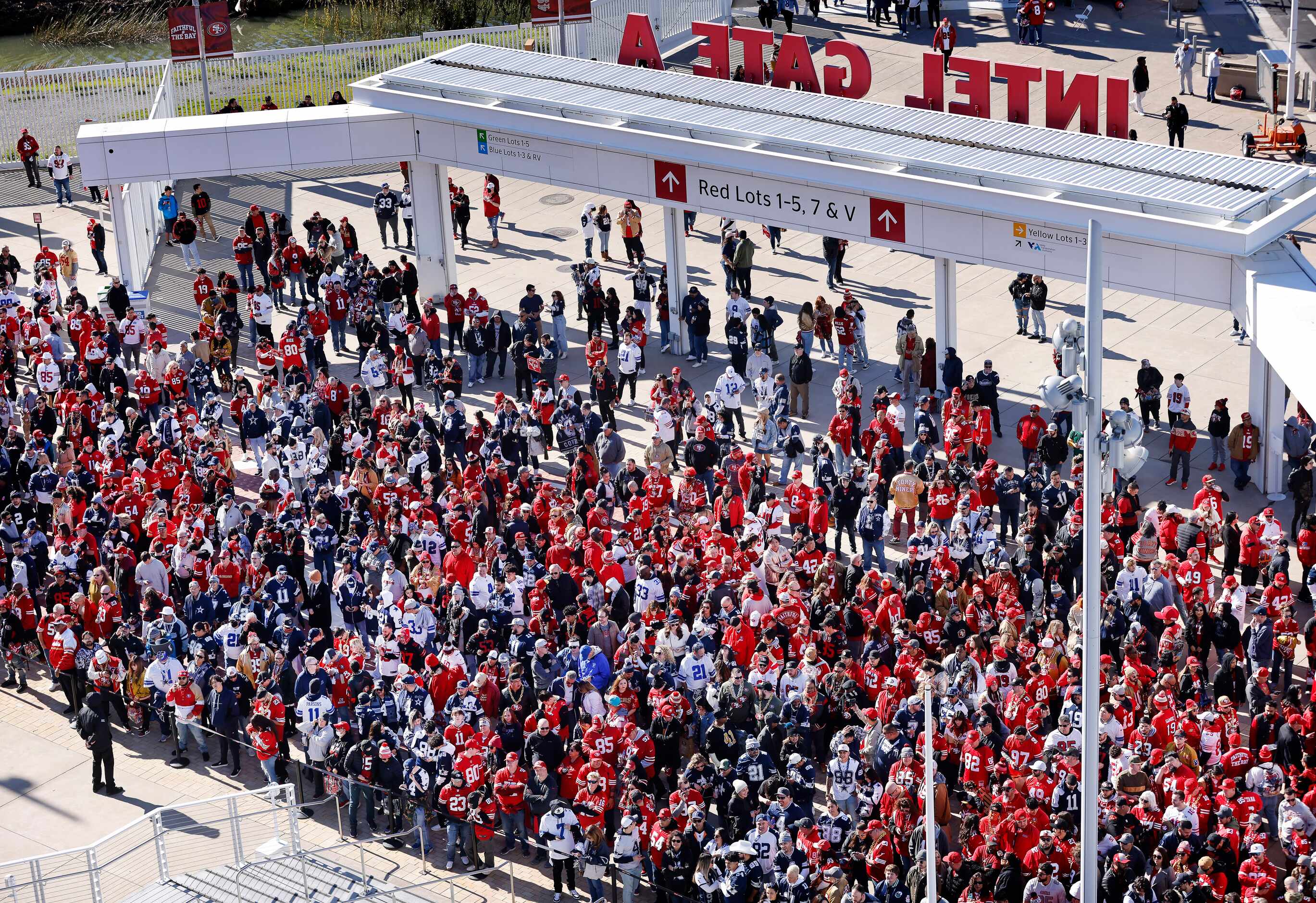Dallas Cowboys and San Francisco 49ers fans wait to get into Levi’s Stadium in Santa Clara,...