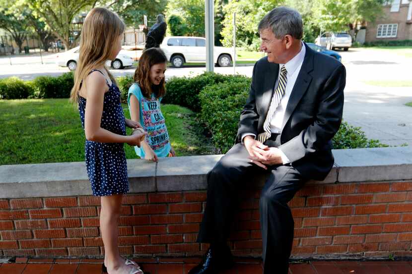  Tom Trigg, the new superintendent for Highland Park ISD, visits with students at elementary...