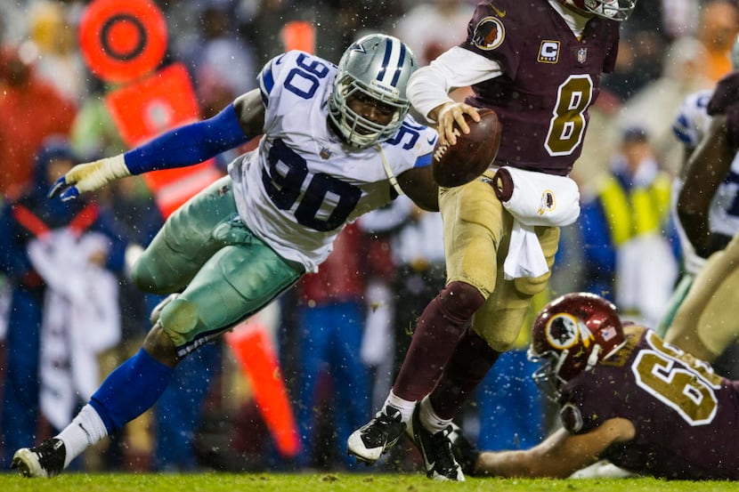 Dallas Cowboys defensive end Demarcus Lawrence (90) threatens Washington Redskins...