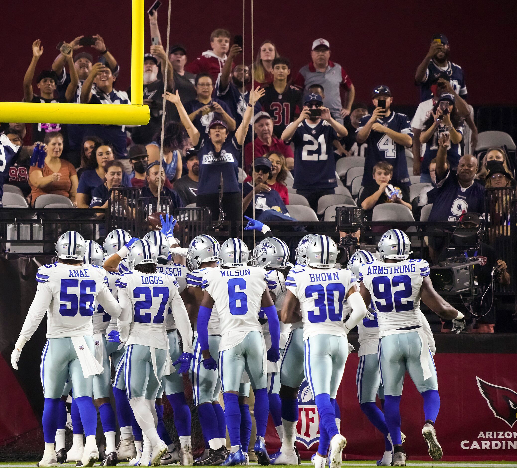 Dallas Cowboys fans cheer as the defense celebrates a fumble recovery by linebacker Keanu...