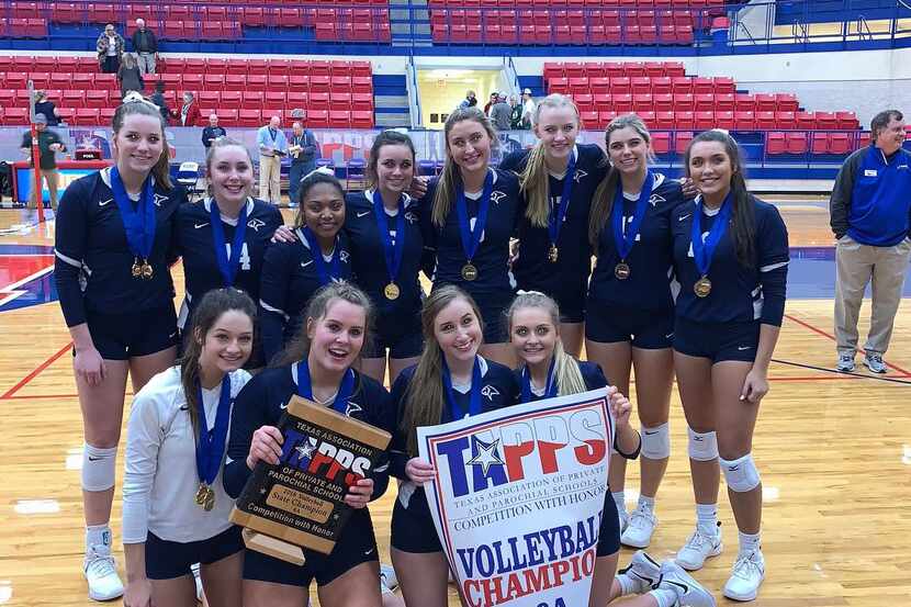 Members of the Prestonwood Christian volleyball team are all smiles after winning the TAPPS...