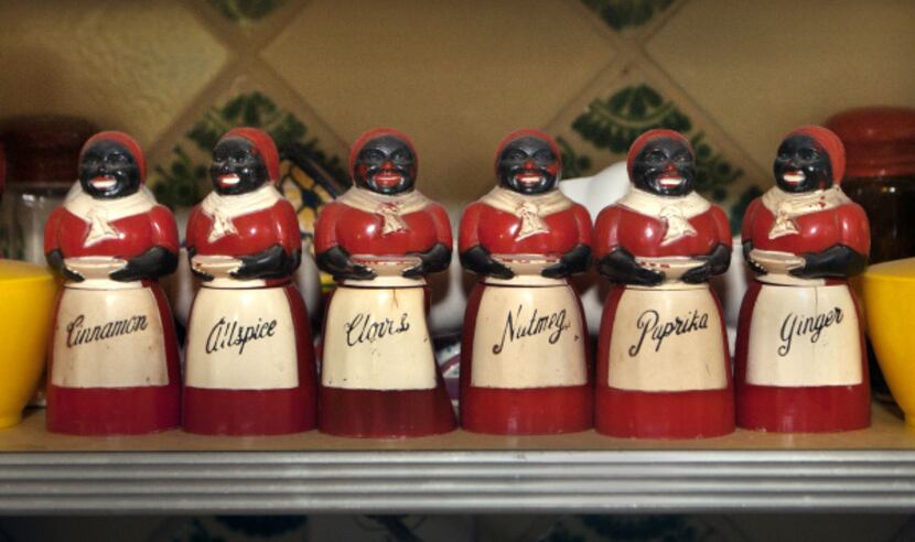 Black memorabilia spice containers in the kitchen of artist Jean Lacy photographed in Dallas...