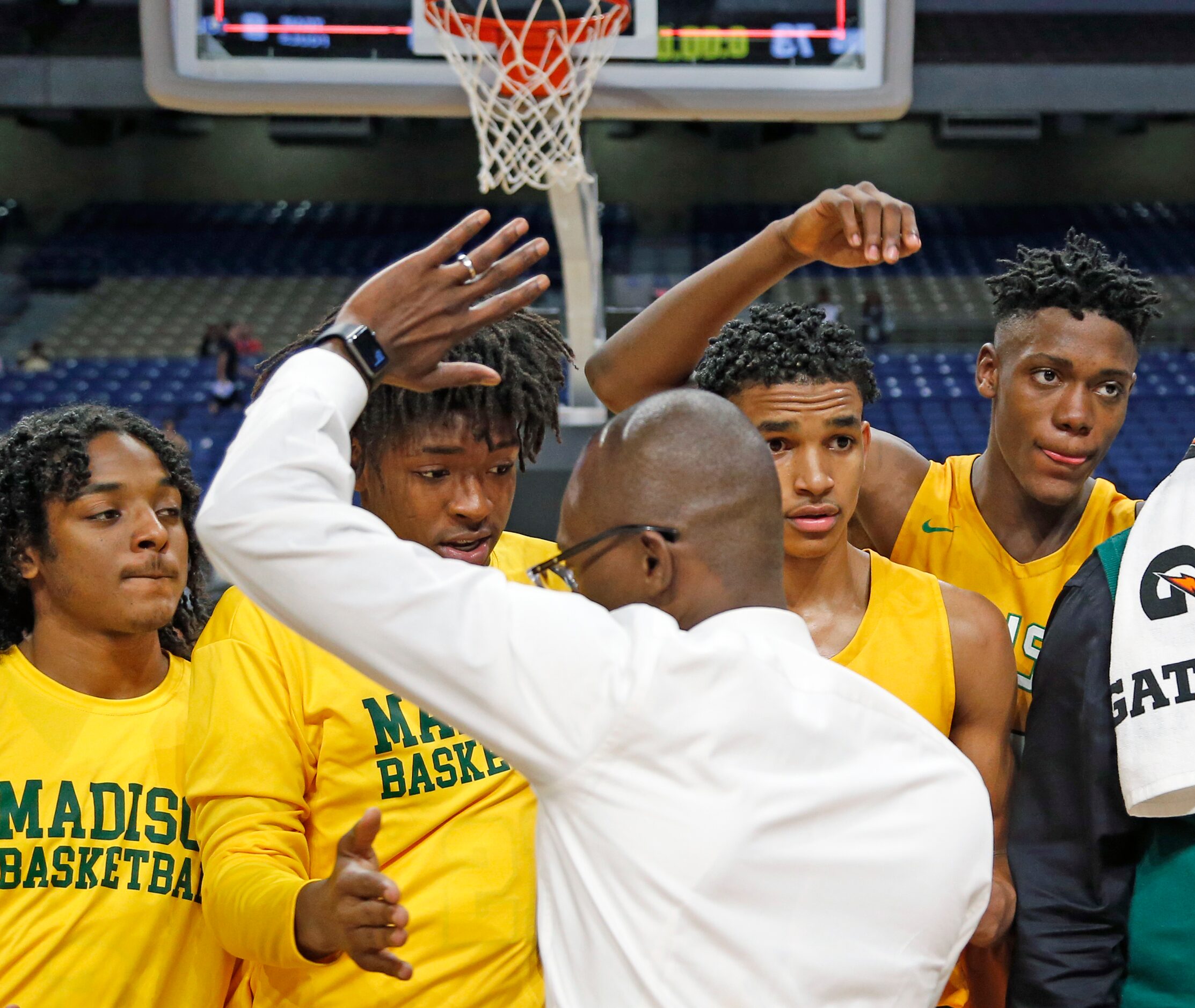 Madison head coach Damien Mobley congratulates his team. Madison defeated...