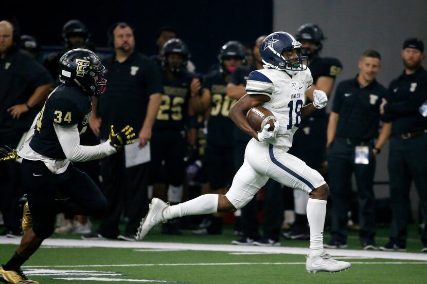 Frisco Lone Star's Marvin Mims (18) outruns The Colony's Ryan Dale (34) to score a touchdown...