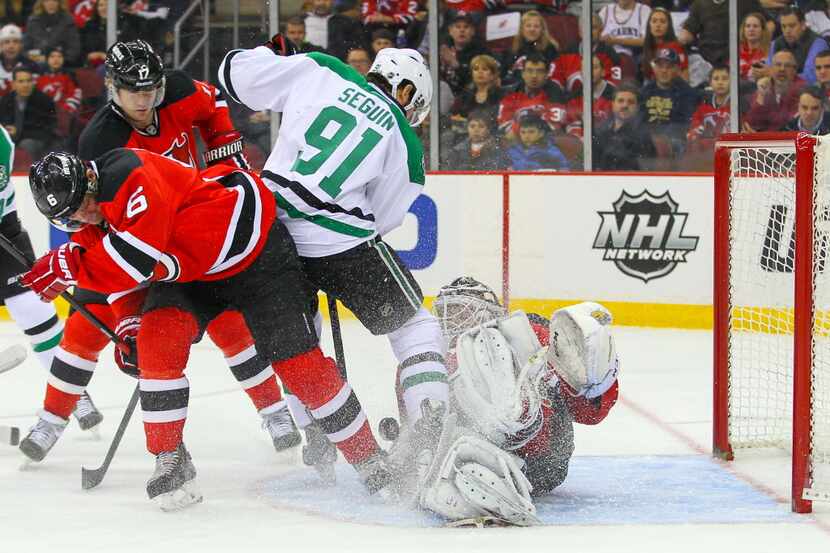 Jan 9, 2014; Newark, NJ, USA; New Jersey Devils goalie Cory Schneider (35) makes a save on...
