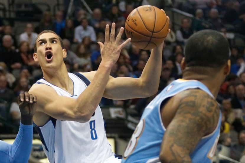 Dallas' Dwight Powell (8) drives past Jameer Nelson, right, in the first half during the...