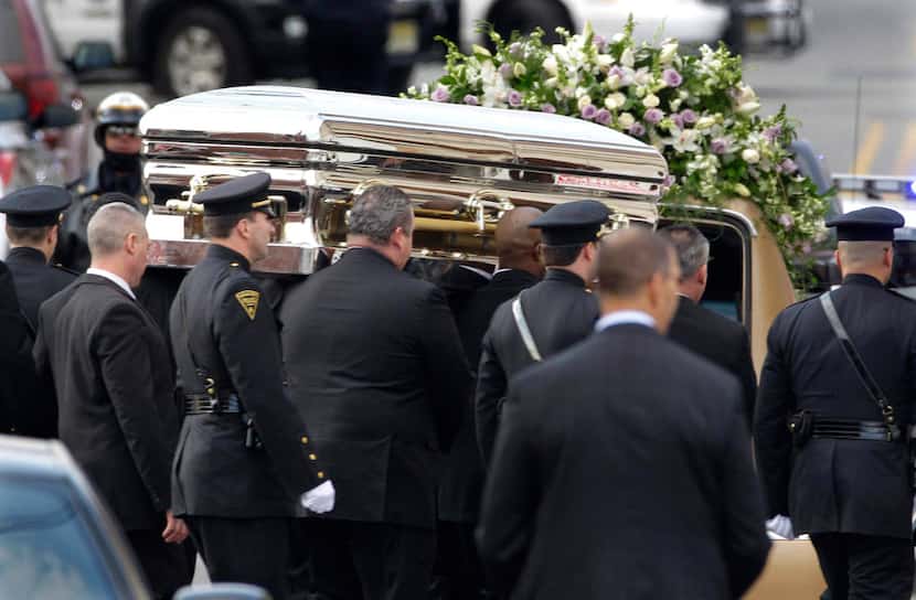 In this Feb. 18, 2012, file photo, the coffin containing singer Whitney Houston is carried...