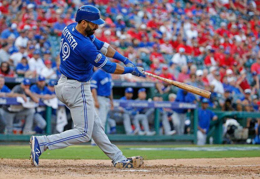 Toronto Blue Jays right fielder Jose Bautista (19) hits a three-run homer in the ninth...
