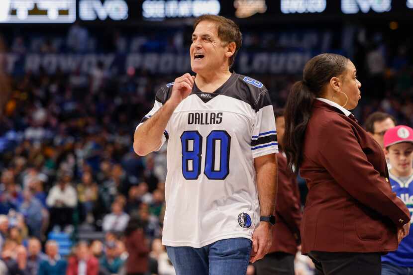 Dallas Mavericks owner Mark Cuban walks the sideline during the first half of an NBA game...