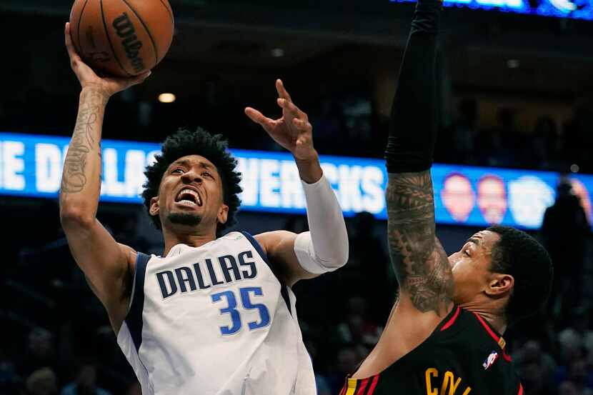 Dallas Mavericks forward Christian Wood (35) shoots against Atlanta Hawks forward John...