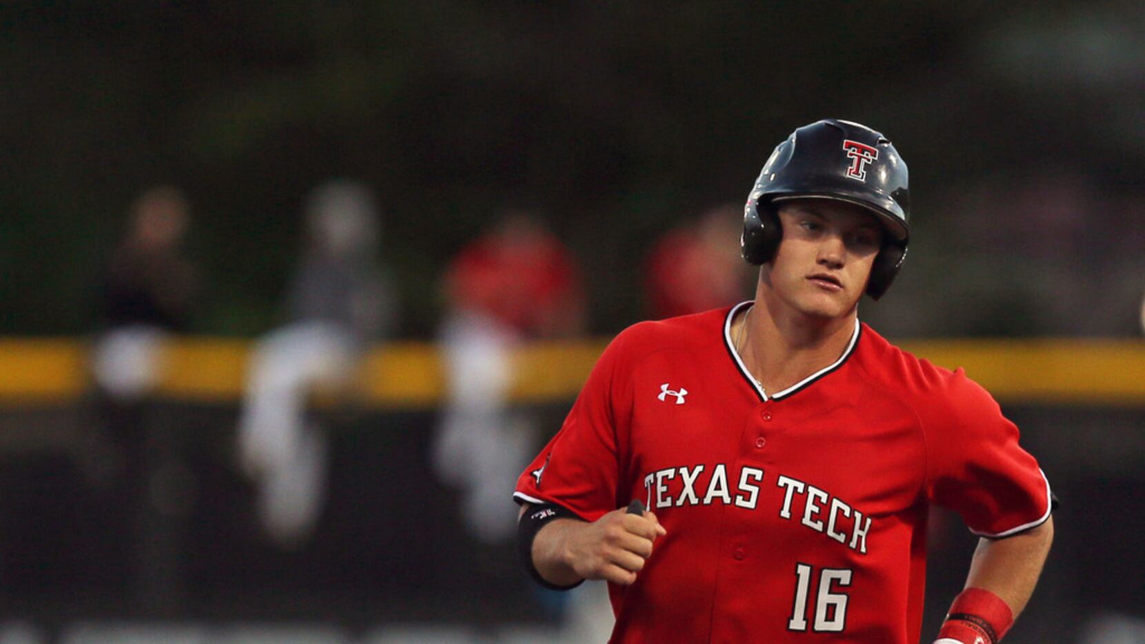 Texas Tech's Josh Jung (16) runs the bases after hitting a home run during an NCAA college...