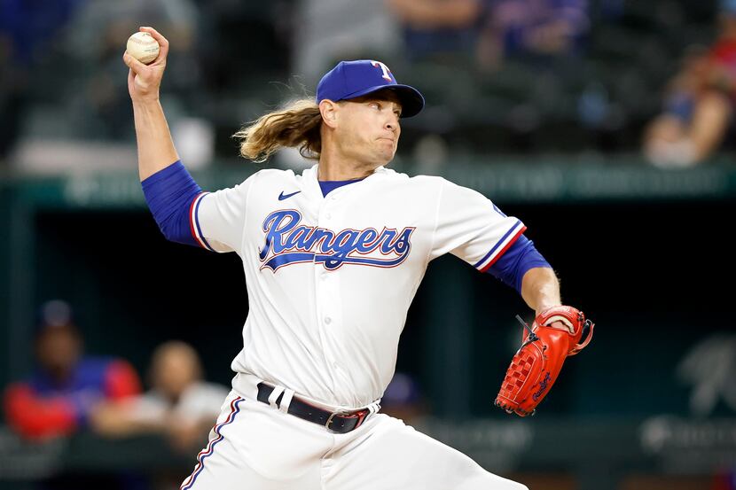Texas Rangers relief pitcher Garrett Richards throws against the Los Angeles Angels during...