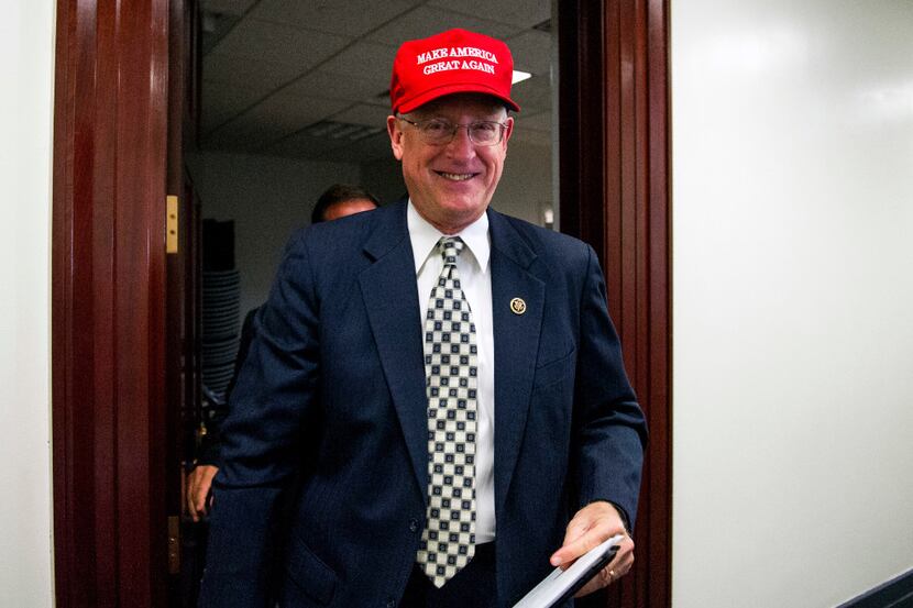 Rep. Mike Conaway, R-Texas, wearing a "Make America Great Again" hat leaves a House...