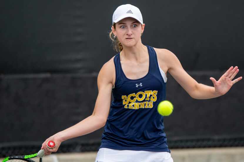 Highland Park's Bridget Stammel returns the ball in a singles match against Austin Lake...