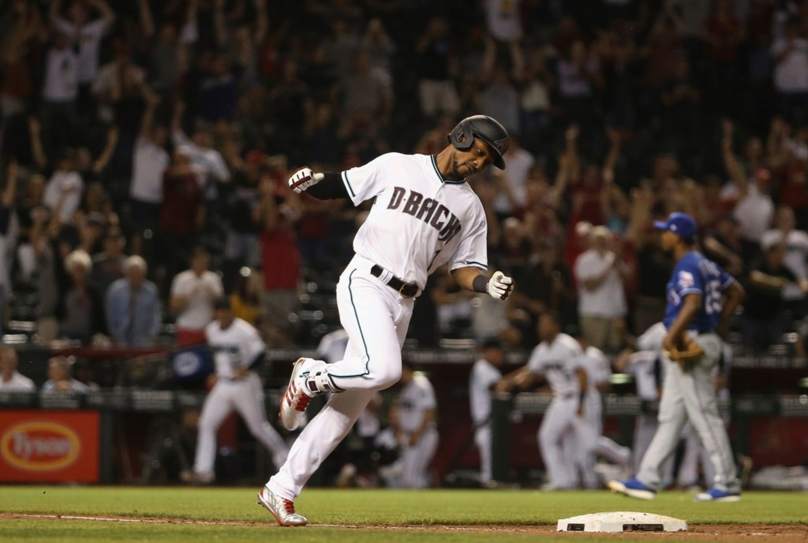 Arizona Diamondbacks' Jarrod Dyson rounds the bases after hitting a walk-off, two-run home...