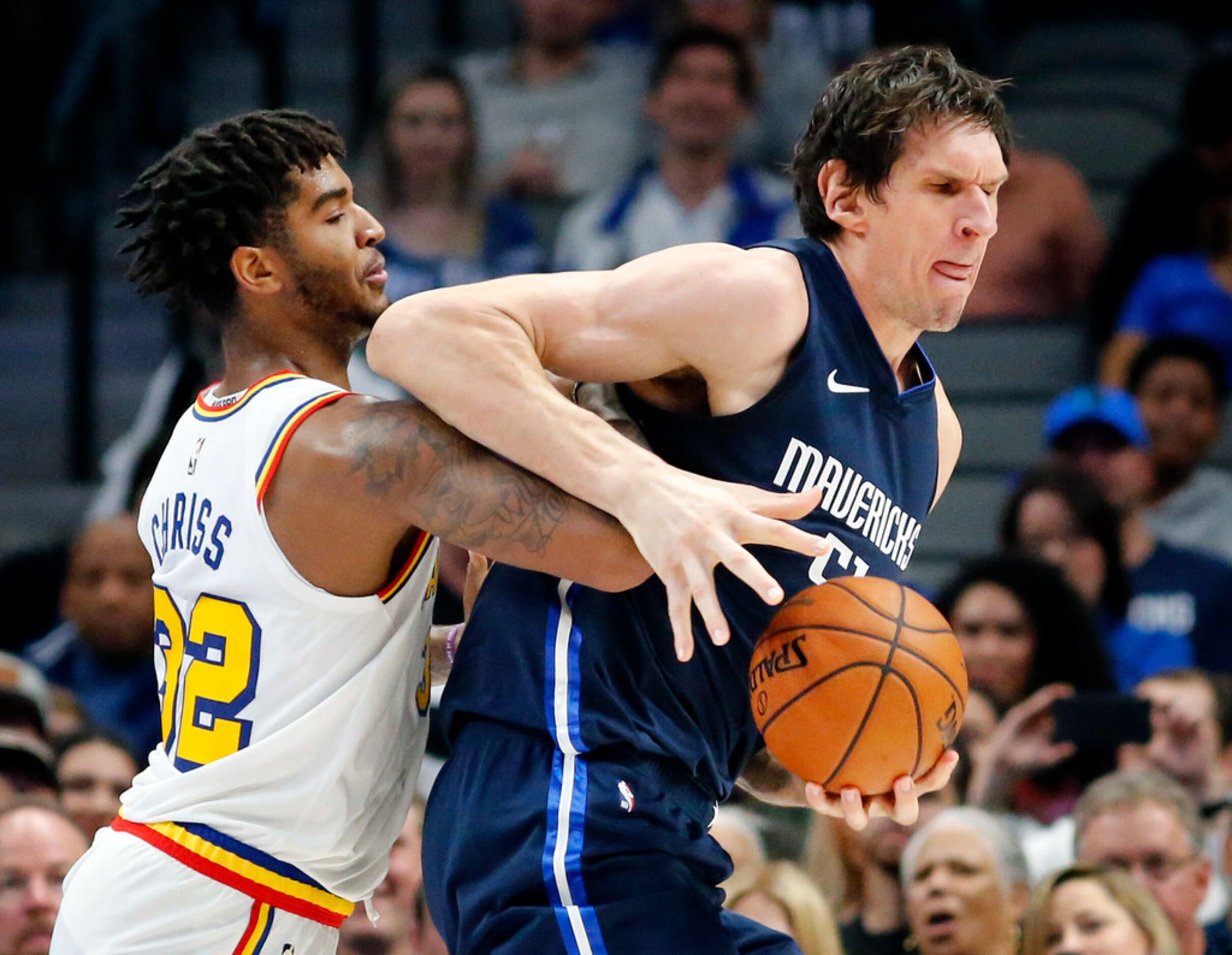 Dallas Mavericks center Boban Marjanovic (51) leans into Golden State Warriors forward...