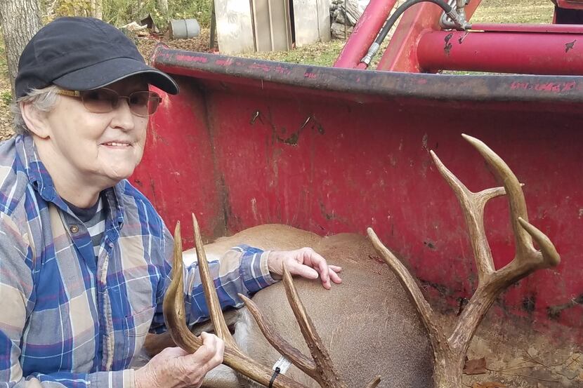 Kennard huntress Virginia Luce with the Houston County 11-pointer she bagged from her...