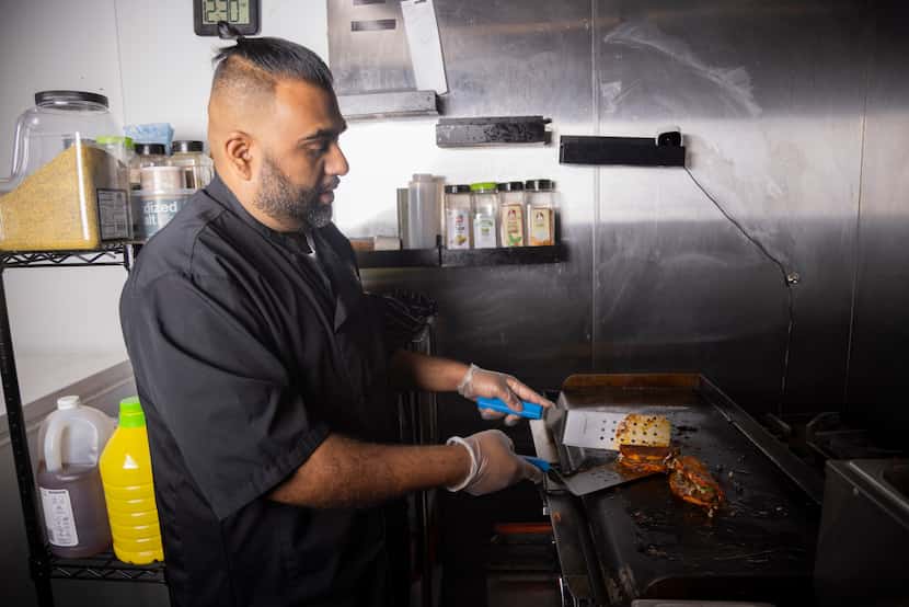Halal Fusionz owner Ahmed Siyaji prepares a Nihari X Birria Taco, which is made with...