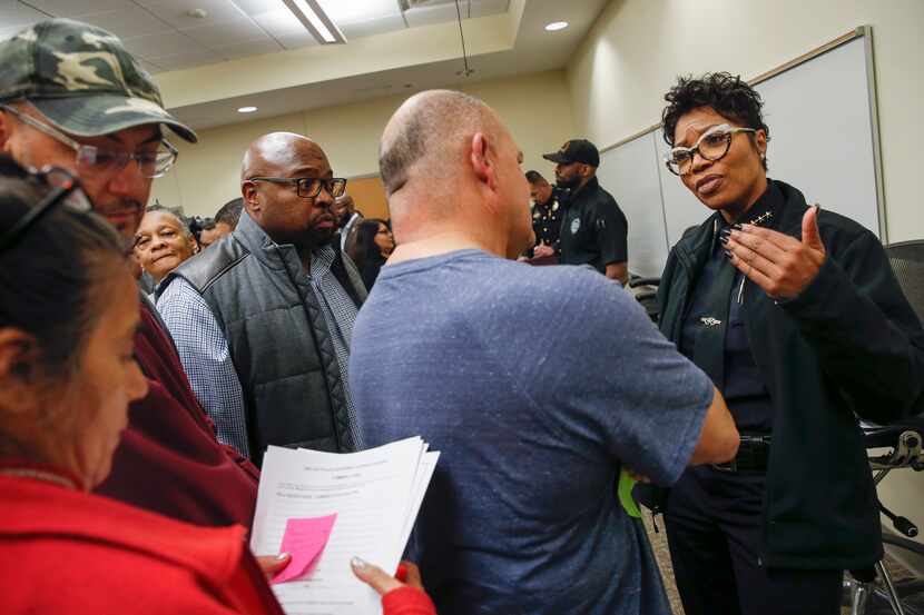 Dallas Police Chief U. Renee Hall, right, speaks with community members during a listening...