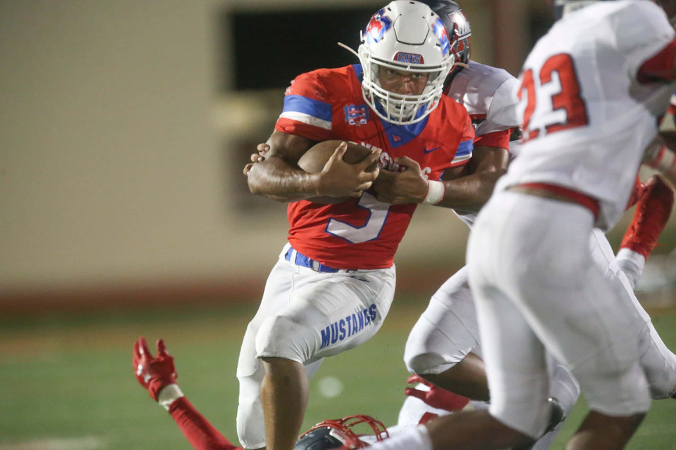 Grapevine running back Caleb Texada (3) carries the ball during the second half of a high...