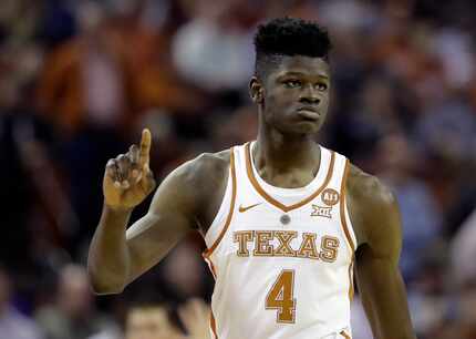Texas forward Mohamed Bamba (4) gestures during the second half of a game against Kansas...