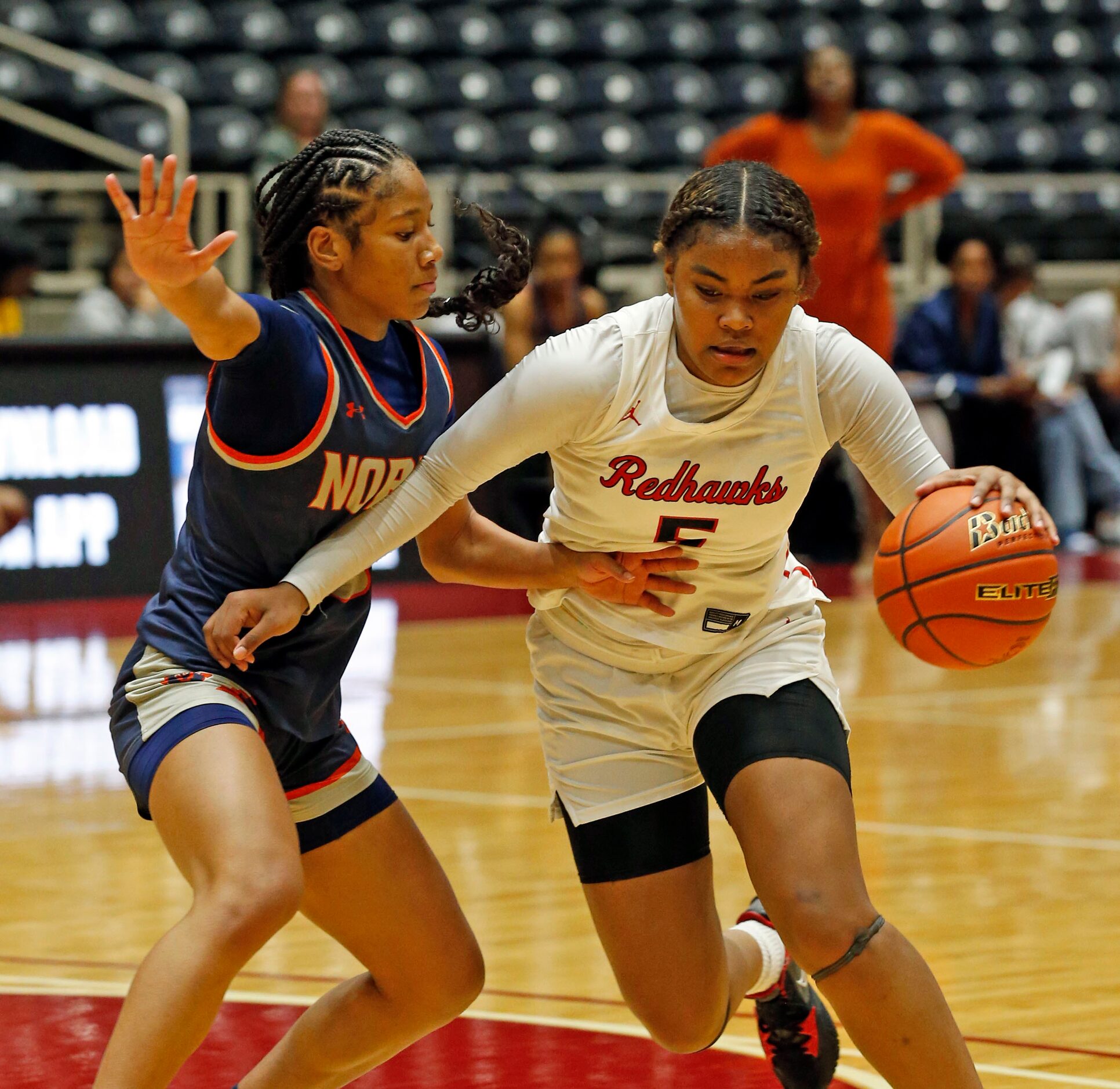 Frisco Liberty High’s G Keyera Roseby (5) works around McKinney North high's G Kaelyn...