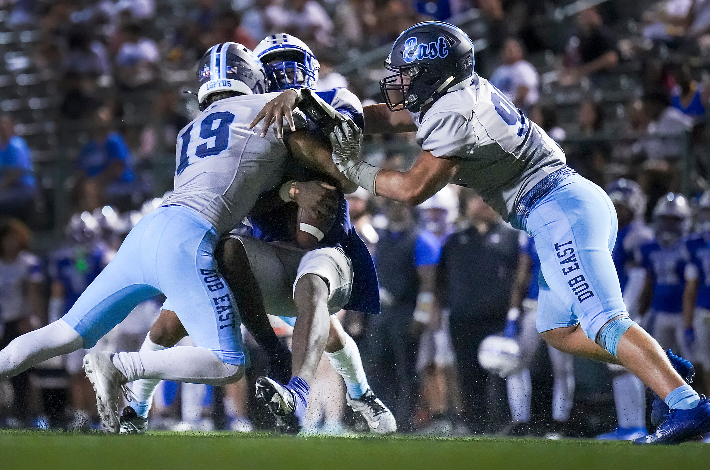 Grand Prairie quarterback Kaleb Harris (4) is dropped for a loss by Wylie East linebacker...