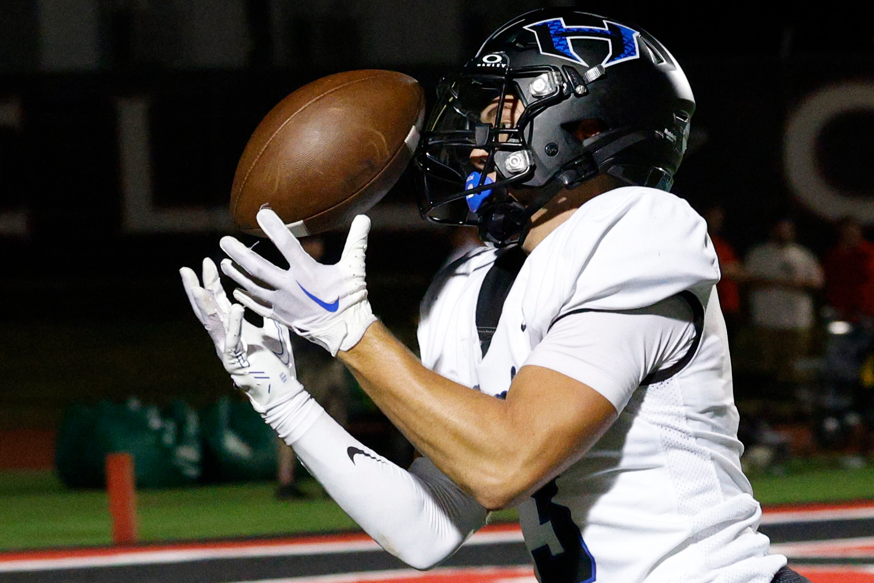 Hebron's Drew Koster (3) catches a pass and runs for a touchdown in the second half of a...