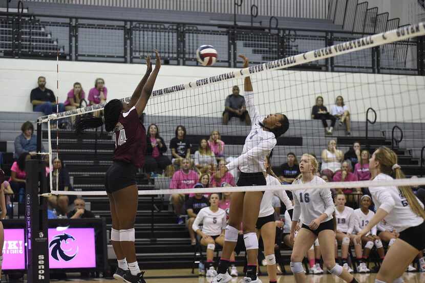 Denton Guyer's Jordyn Williams (7) spikes the ball during a match against Wylie in 2017....