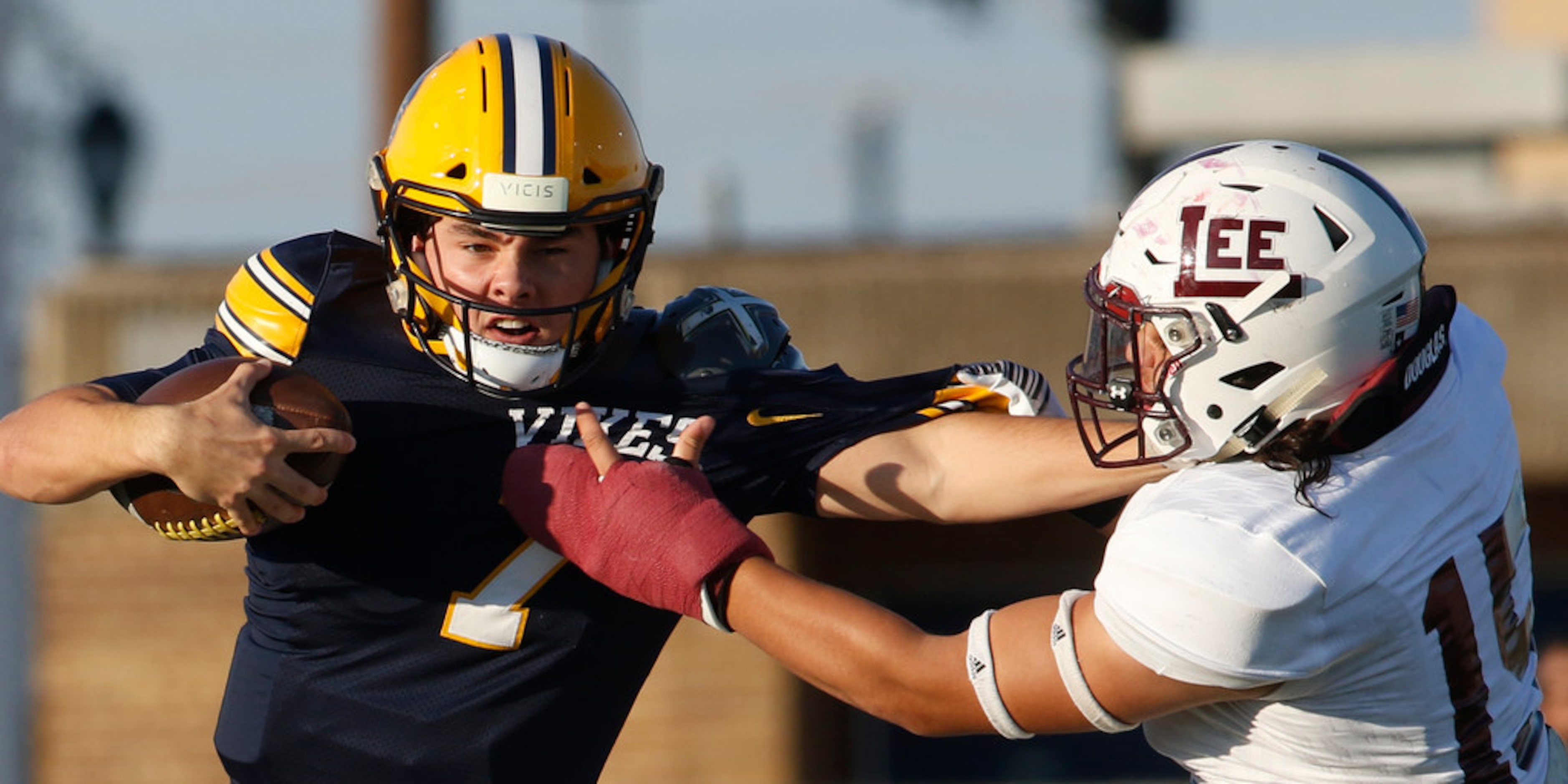 Arlington Lamar quarterback Jack Dawson (7) is tackled by Midland Lee linebacker Michael...