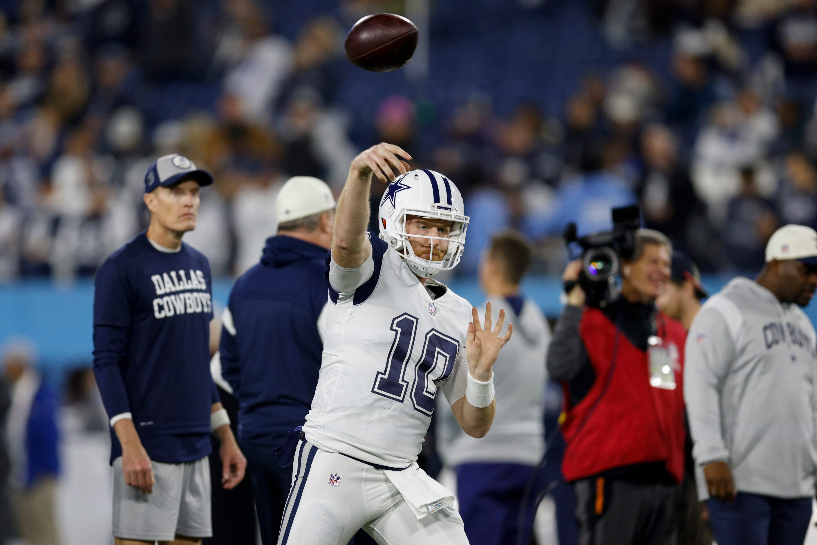 Dallas Cowboys quarterback Cooper Rush (10) warms up wearing the team’s new Color Rush...