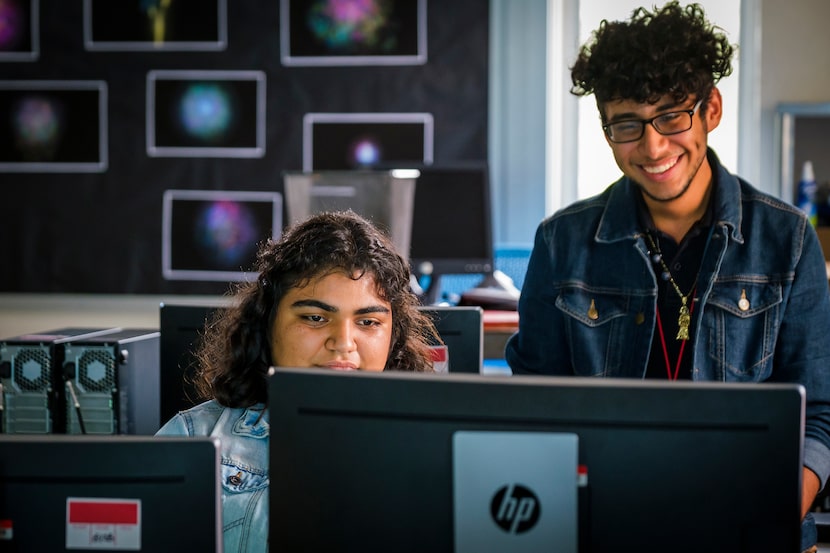 Emily Juarez (left) and Wilver Amaya play a video game during a practice of the Skyline High...