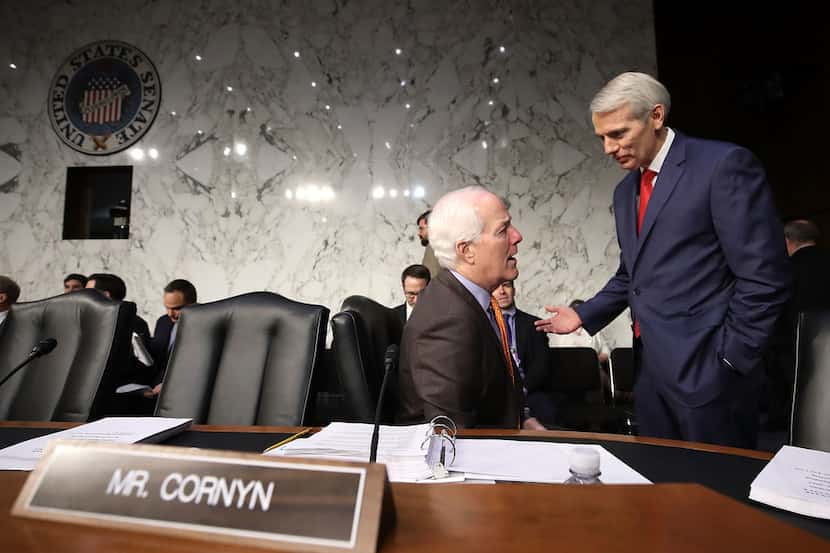 Texas Sen. John Cornyn (left) on Monday withdrew his support for Alabama Republican Roy...