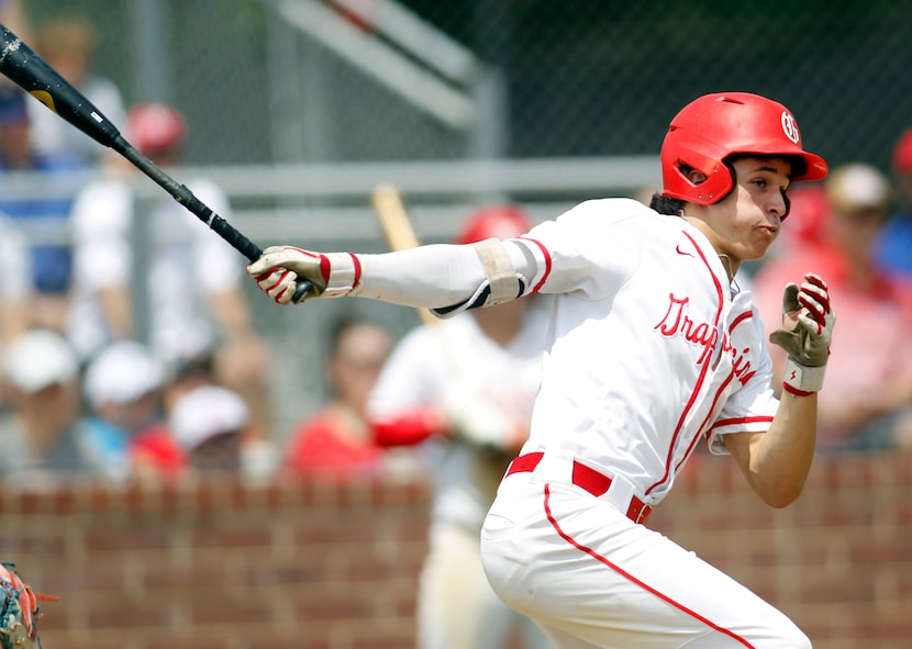 Grapevine's Sammy Kelley (10) watches a line drive fall for a base hit during the bottom of...