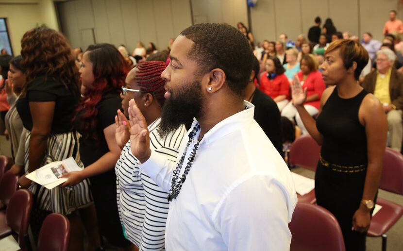 Members of North Texas' latest crop of CPS workers, "Class V36," took an oath of office and...